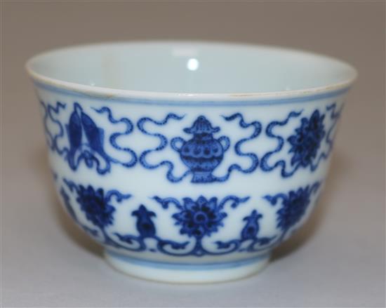 A Chinese blue and white Eight Buddhist emblems cup, bearing a Daoguang seal mark, diameter 7.3cm